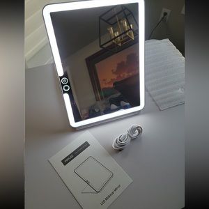 New. LED portable white travel mirror.
